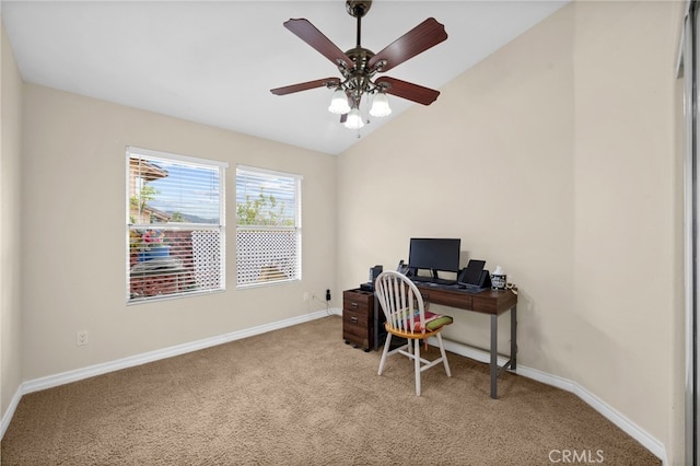 carpeted home office featuring baseboards, a ceiling fan, and vaulted ceiling
