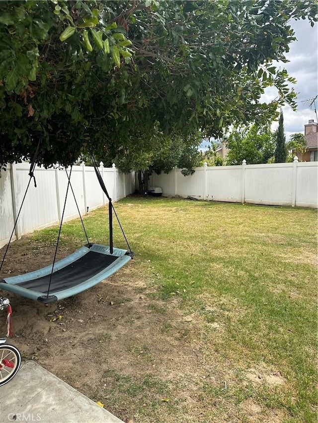 view of yard with a fenced backyard