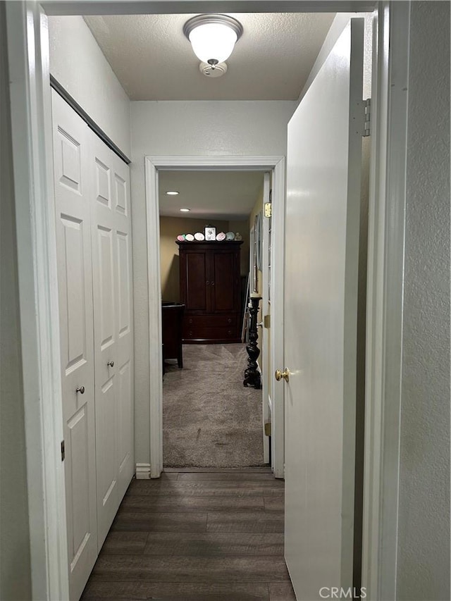 hall with dark wood-type flooring