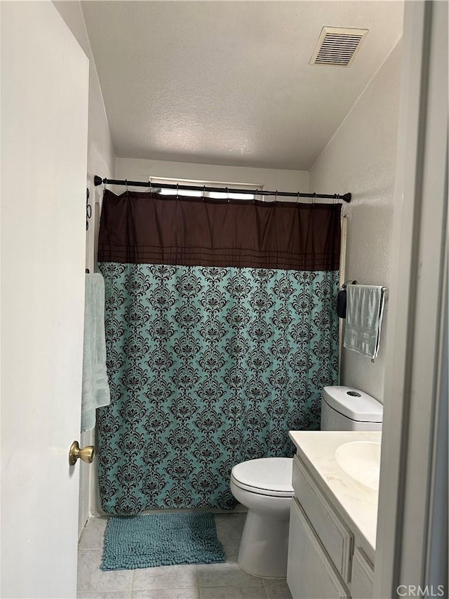 full bathroom with vanity, toilet, tile patterned floors, a shower with shower curtain, and visible vents
