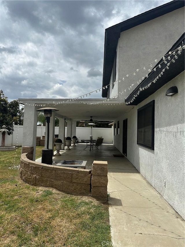 exterior space with fence and a patio area
