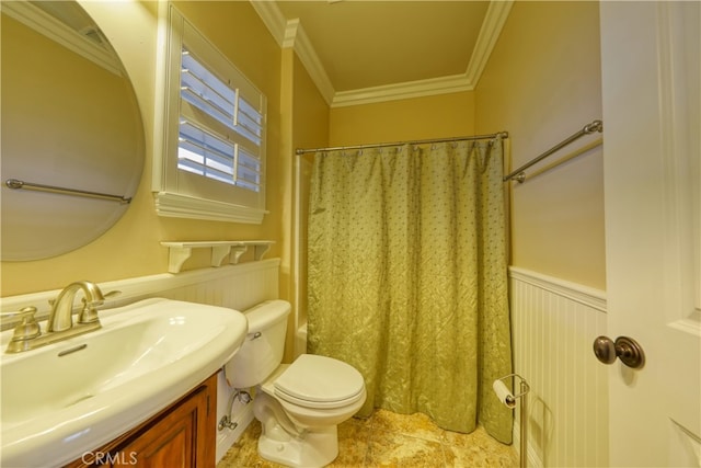 bathroom featuring crown molding, vanity, toilet, a shower with shower curtain, and a wainscoted wall