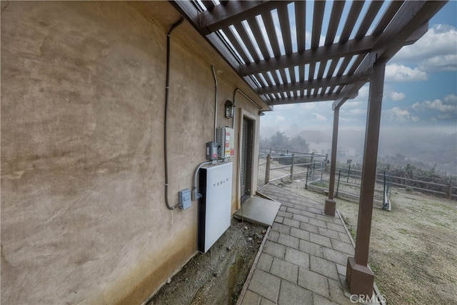view of patio / terrace featuring fence and a pergola