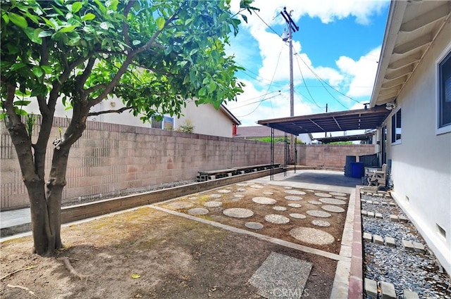 view of yard with a patio and a fenced backyard
