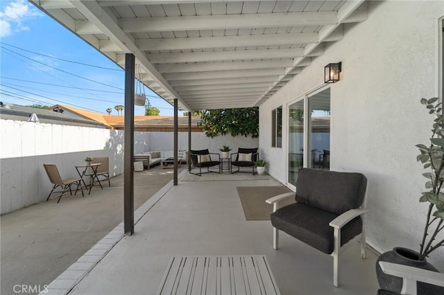 view of patio with fence and an outdoor living space
