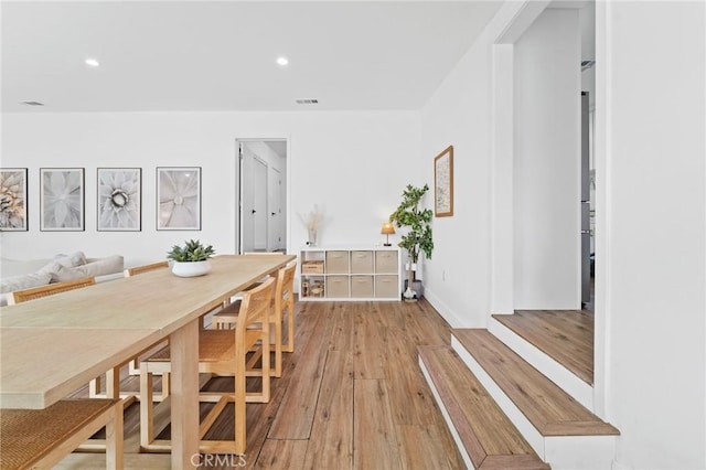 dining room with recessed lighting, wood finished floors, and visible vents