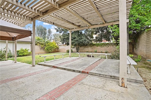 view of patio with a fenced backyard and a pergola