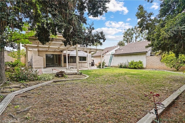 view of yard featuring a patio, fence, and a pergola