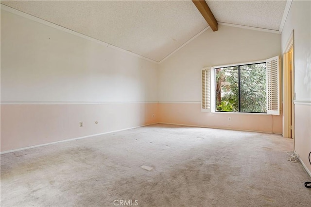 carpeted spare room with baseboards, lofted ceiling with beams, and a textured ceiling