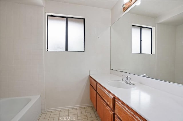 bathroom featuring vanity and baseboards