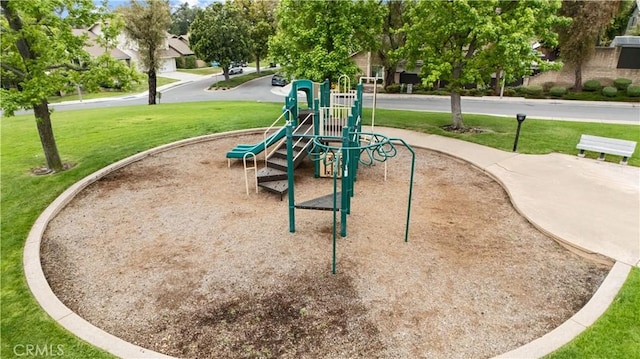 view of community with a lawn and playground community