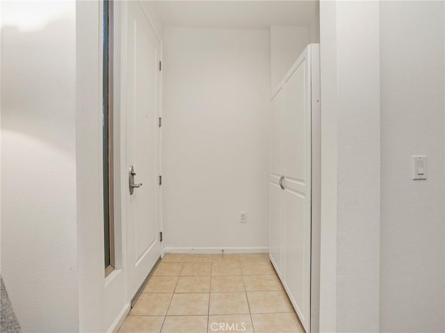 hallway with light tile patterned floors