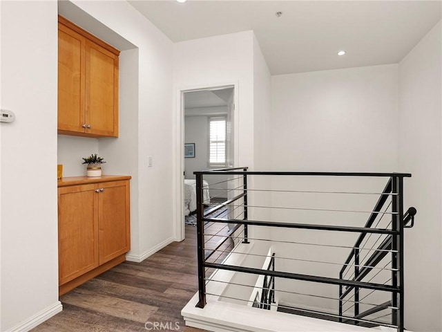 stairs featuring recessed lighting, baseboards, and wood finished floors