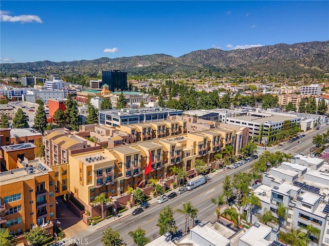 drone / aerial view with a view of city and a mountain view