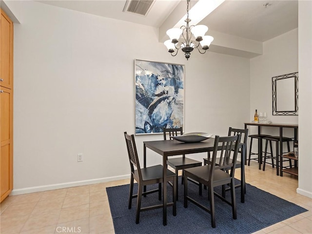 dining space featuring light tile patterned flooring, baseboards, a notable chandelier, and visible vents