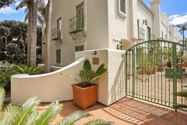 view of gate with fence