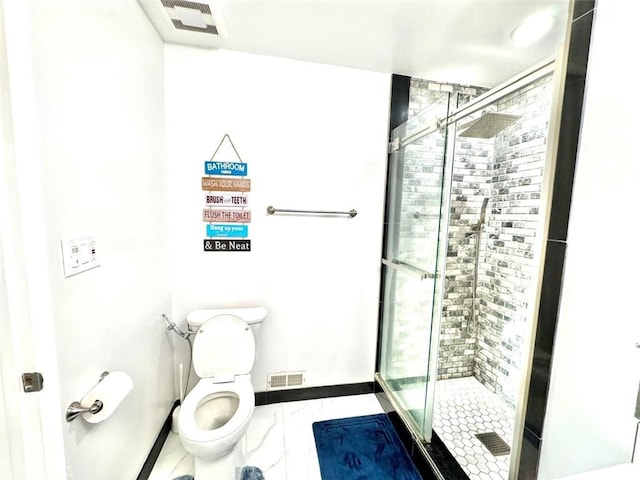 bathroom with toilet, baseboards, visible vents, and a stall shower