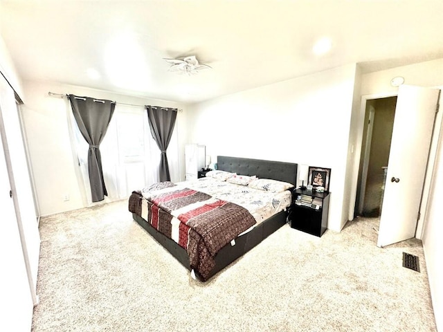 bedroom featuring light colored carpet, recessed lighting, and visible vents