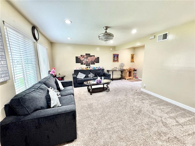 carpeted living room featuring visible vents, recessed lighting, and baseboards