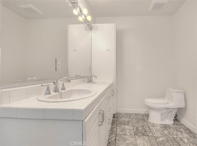 3442 Delta Ave, Rosemead, CA 91770 - full bathroom with baseboards and double vanity