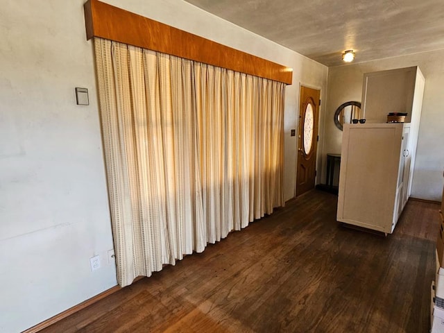 empty room featuring dark wood-style floors
