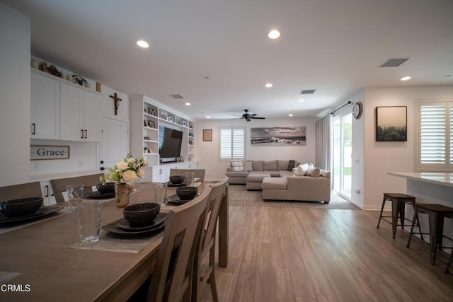 dining room with ceiling fan, light wood-type flooring, recessed lighting, and visible vents