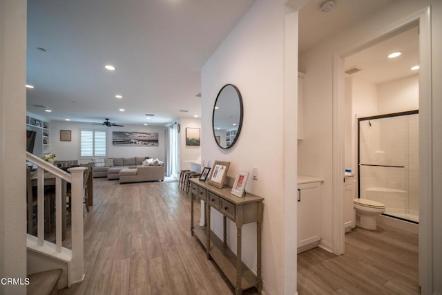 hall with recessed lighting and light wood finished floors