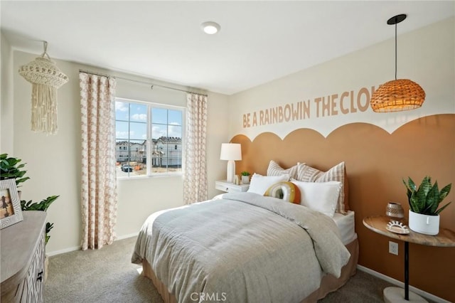 bedroom with carpet floors and baseboards
