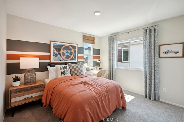 carpeted bedroom featuring baseboards