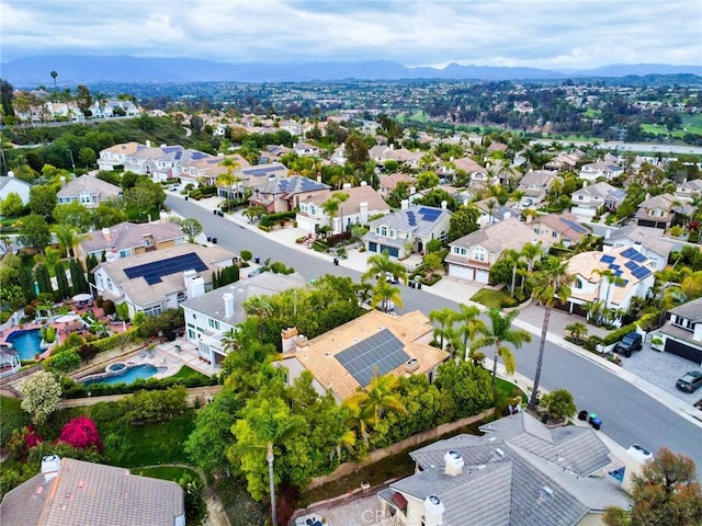 birds eye view of property with a residential view and a mountain view