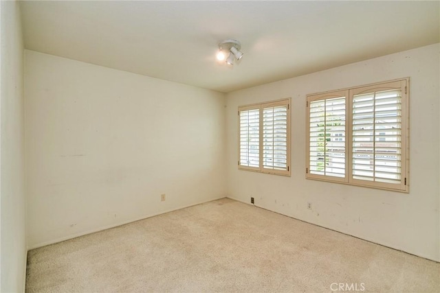 spare room featuring carpet floors