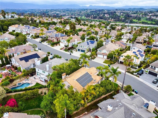 birds eye view of property with a mountain view and a residential view