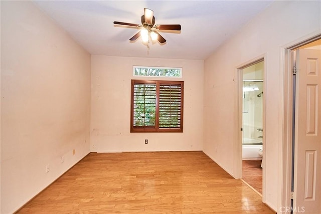 empty room featuring a ceiling fan and light wood-style flooring