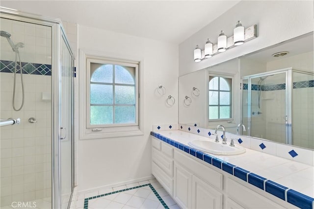 22122 Cape May Ln, Huntington Beach, CA 92646 - full bathroom with vanity, baseboards, tile patterned floors, and a shower stall