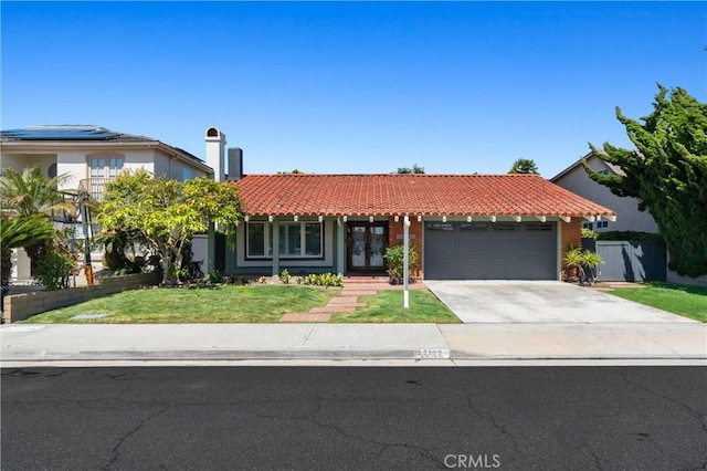 22122 Cape May Ln, Huntington Beach, CA 92646 - view of front of home with a garage, a front yard, french doors, a tiled roof, and driveway