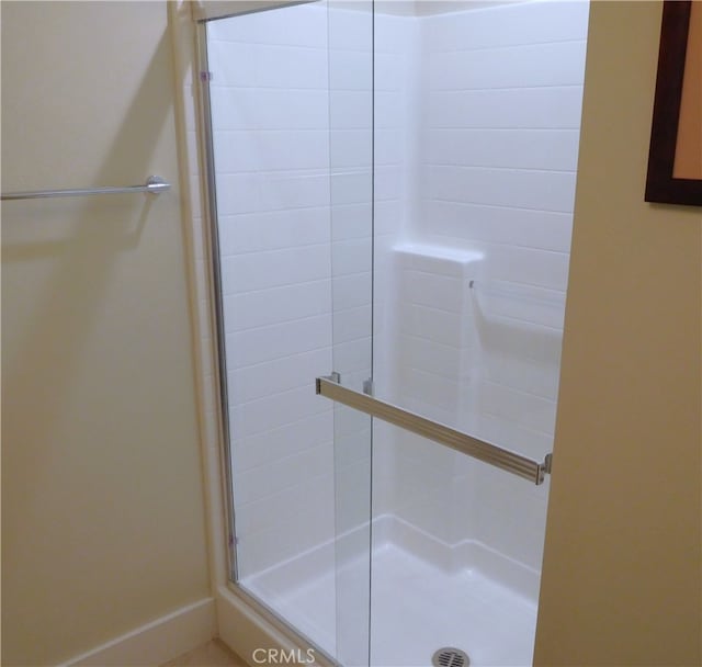 full bath featuring a stall shower