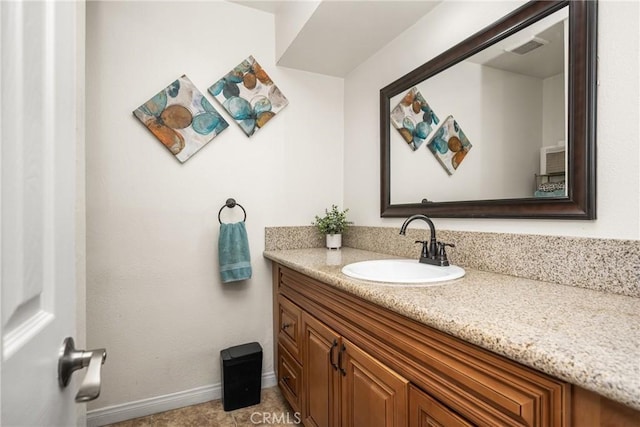 134 S Magnolia Ave Unit 21A, Anaheim, CA 92804 - bathroom featuring visible vents, baseboards, and vanity