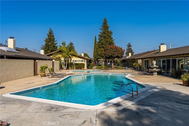 134 S Magnolia Ave Unit 21A, Anaheim, CA 92804 - community pool with a hot tub, a patio, and fence