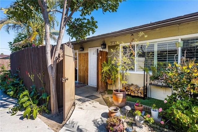 134 S Magnolia Ave Unit 21A, Anaheim, CA 92804 - doorway to property featuring stucco siding and fence
