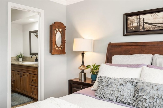 134 S Magnolia Ave Unit 21A, Anaheim, CA 92804 - bedroom featuring crown molding, a sink, and ensuite bathroom