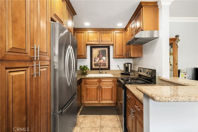 134 S Magnolia Ave Unit 21A, Anaheim, CA 92804 - kitchen with brown cabinetry, stainless steel appliances, and under cabinet range hood