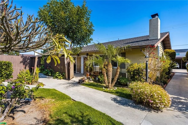 134 S Magnolia Ave Unit 21A, Anaheim, CA 92804 - ranch-style home with fence, a chimney, and stucco siding