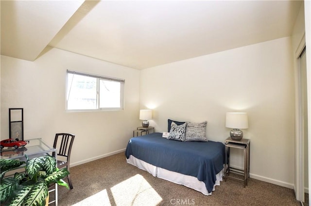 carpeted bedroom with baseboards