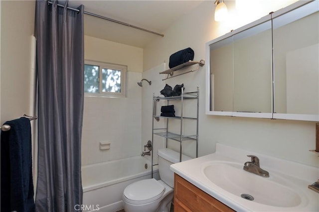 full bathroom featuring vanity, shower / bath combo, and toilet