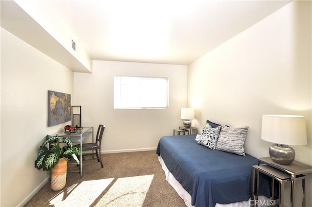 bedroom with carpet floors, baseboards, and visible vents
