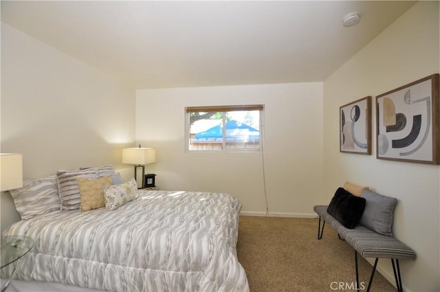 carpeted bedroom with baseboards