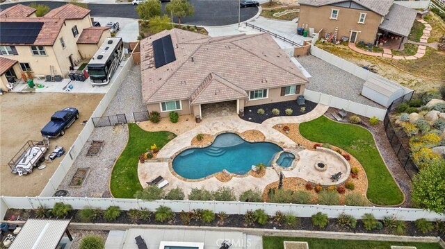 30404 Canyon Point Cir, Menifee, CA 92584 - view of swimming pool with a fenced backyard, a pool with connected hot tub, a residential view, and a patio