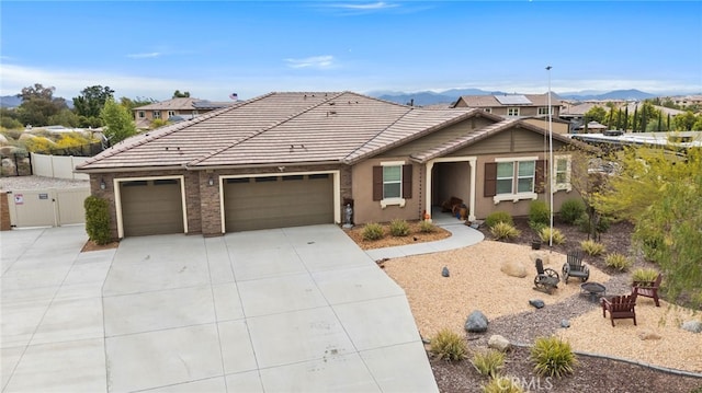 30404 Canyon Point Cir, Menifee, CA 92584 - single story home with driveway, an attached garage, a mountain view, and a tiled roof