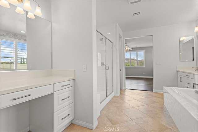 30404 Canyon Point Cir, Menifee, CA 92584 - full bathroom featuring vanity, a shower stall, tile patterned flooring, a garden tub, and a ceiling fan