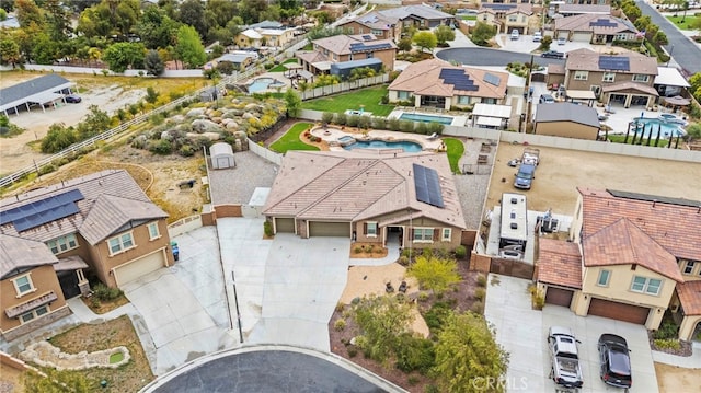 birds eye view of property with a residential view
